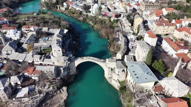 Drone aerial view of Stari Most (Old Bridge) and Koski Mehmed Pasha Mosque in Mostar, Bosnia and Herzegovina