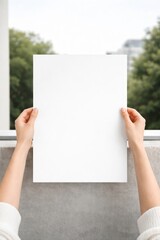 Blank paper held outdoors.