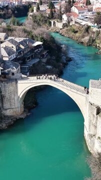 Drone aerial view of Stari Most (Old Bridge) and Koski Mehmed Pasha Mosque in Mostar, Bosnia and Herzegovina