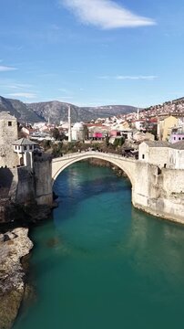 Drone aerial view of Stari Most (Old Bridge) and Koski Mehmed Pasha Mosque in Mostar, Bosnia and Herzegovina