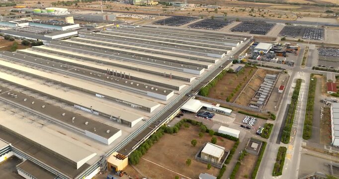 Aerial view of the Fiat car factory and production facilities located in the industrial area of ​​San Nicola, near Melfi, Basilicata, Italy. A large industrial complex with extensive parking lots.