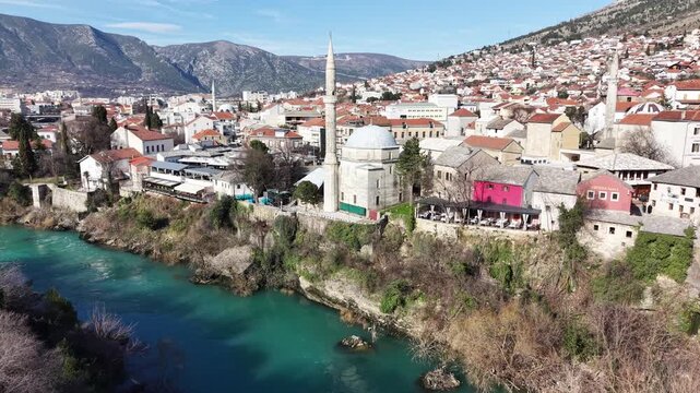 Drone aerial view of Stari Most (Old Bridge) and Koski Mehmed Pasha Mosque in Mostar, Bosnia and Herzegovina