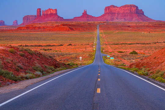 Monument Valley in Utah, looking south on U.S. Route 163  north of the Utah&ndash;Arizona state line also known as Forrest Gump point early in the morning blue hour dawn.