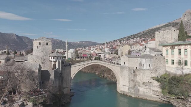 Drone aerial view of Stari Most (Old Bridge) and Koski Mehmed Pasha Mosque in Mostar, Bosnia and Herzegovina