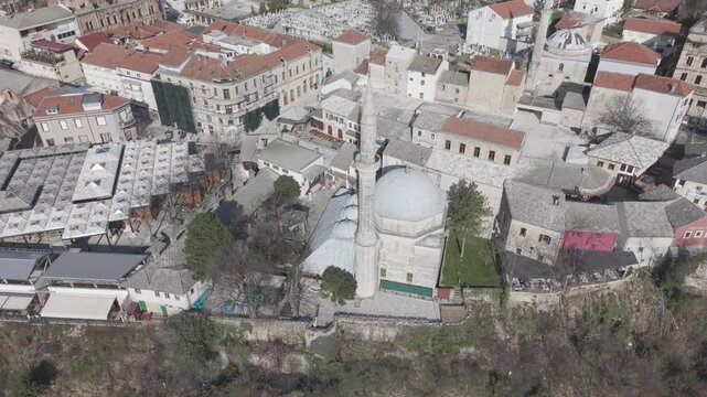 Drone aerial view of Stari Most (Old Bridge) and Koski Mehmed Pasha Mosque in Mostar, Bosnia and Herzegovina