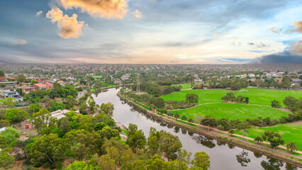 Obraz premium Panoramic Aerial Drone view of Inner Suburbs of Melbourne housing, roof tops, the streets and the parks, the roads and trees of Ascot Vale Moonee Ponds Brunswick Essendon and Maribyrnong in VIC Victor