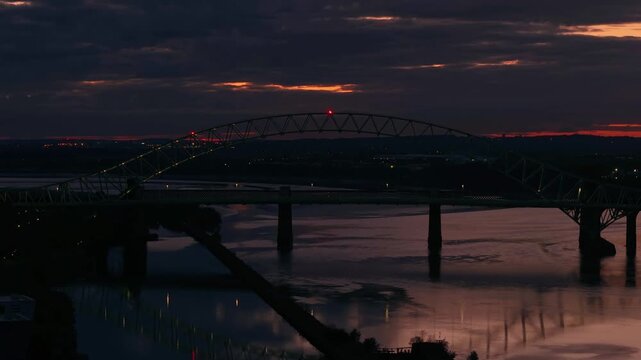 Liverpool, Merseyside, UK, September 09, 2025; aerial 4K video footage of the Silver Jubilee Bridge and Britannia Railway Viaduct over the River Mersey and Manchester Ship Canal, Runcorn, Merseyside