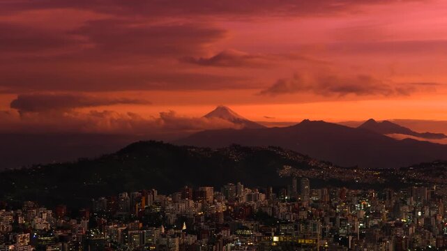 Quito, Ecuador at sunset with a view of the Cotopaxi volcano and clouds