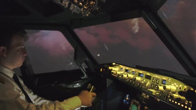 Professional male pilot navigates airplane with steering wheel making maneuver. Skilled captain guides airplane during lightning