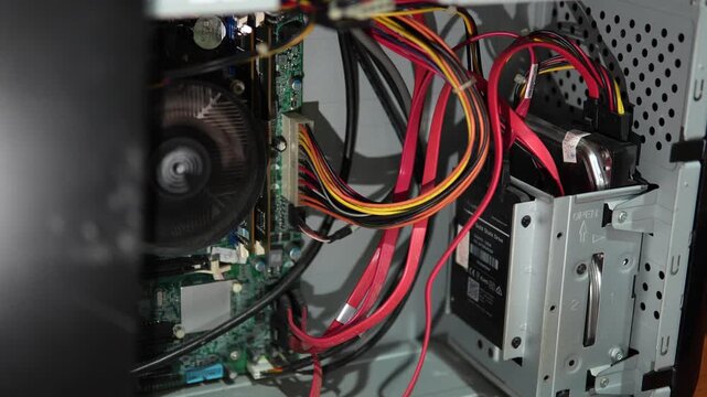 Interior view of a computer case with cables and components
