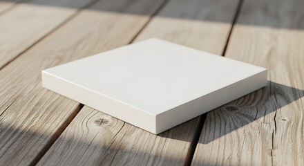 Fototapeta premium White square box on wooden deck, empty blank mockup, sunlight shadow