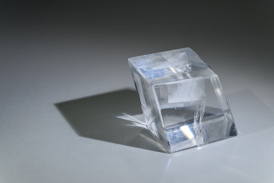 A calcite cube on a white background.