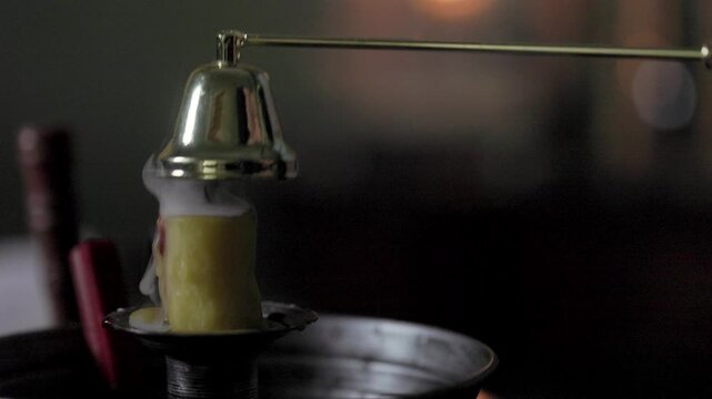 candle being snuffed out showing trail of smoke from wick