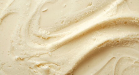 Close up of smooth vanilla ice cream texture with creamy swirls on a pale backdrop Copy Space