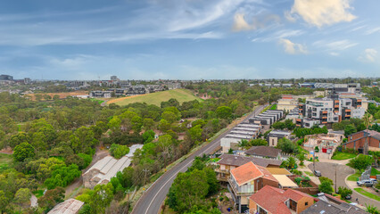 Naklejka premium Panoramic Aerial Drone view of Inner Suburbs of Melbourne housing, roof tops, the streets and the parks, the roads and trees of Ascot Vale Moonee Ponds Brunswick Essendon and Maribyrnong in VIC Victor