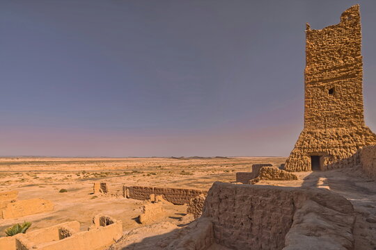 The harsh desert sun shines on an adobe brick, rammed earth (pis?) and mud blockhouse of a former French Foreign Legion fort. Ksar Guedim-Morocco-175