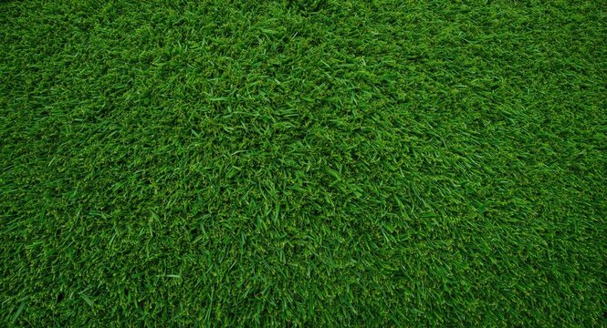 Bright artificial turf texture forming a vivid green backdrop perfect for design and landscaping