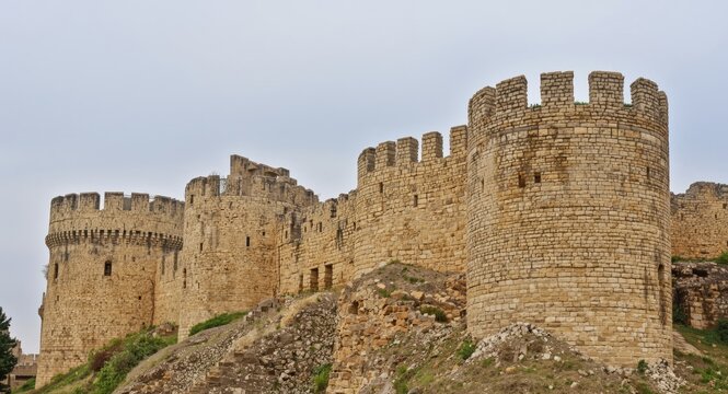 Crusader castle stone walls standing tall with defensive parapets