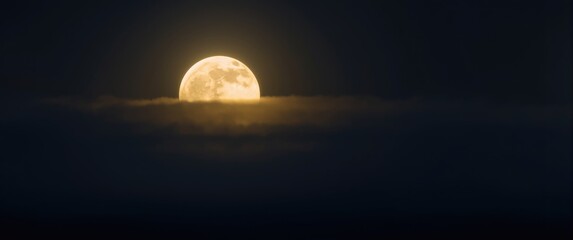 Complete moon glowing through layers of gentle mist