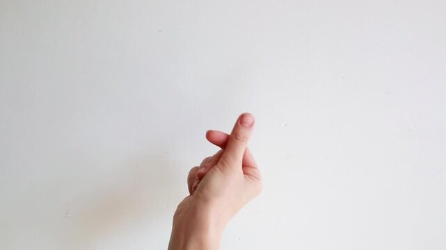 Female hands making heart shape gesture . Symbol of love, care, affection and romantic emotion.