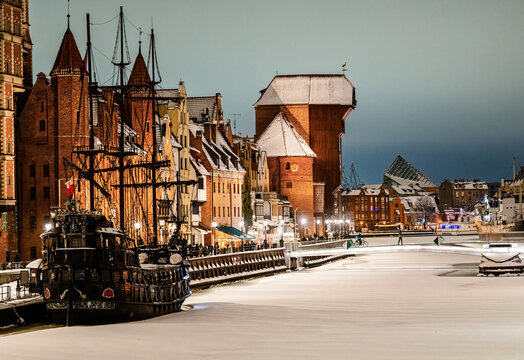Winter view of the Motlawa River embankment at night, Gdansk, Poland.