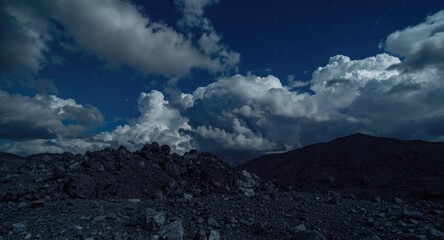 Dramatic night clouds above mining rocks full of raw minerals with copy space