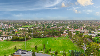 Obraz premium Panoramic Aerial Drone view of Inner Suburbs of Melbourne housing, roof tops, the streets and the parks, the roads and trees of Ascot Vale Moonee Ponds Brunswick Essendon and Maribyrnong in VIC Victor