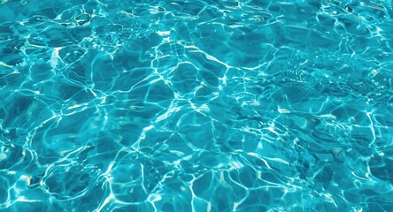 Obraz premium Bright turquoise water with varied ripple formations and luminous light reflections copy space