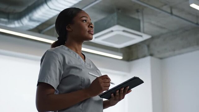 Nurse with tablet in office.