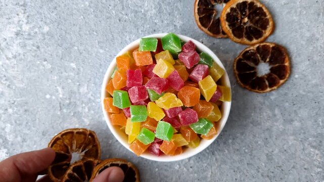Candied fruit in colorful cubes as an ingredient for baked goods and sweets. Candied fruit as a food background for your design