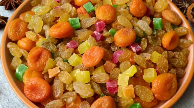 Dried apricots, raisins, and candied fruits as ingredients for baked goods and sweets. Dried fruits as a food background for your design