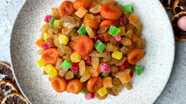 Dried apricots, raisins, and candied fruits as ingredients for baked goods and sweets. Dried fruits as a food background for your design