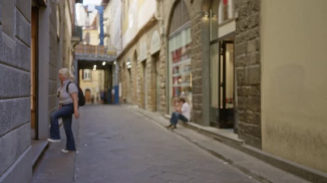 Florence alley with defocused stone facades and shallow bokeh background; template overlay virtual production.