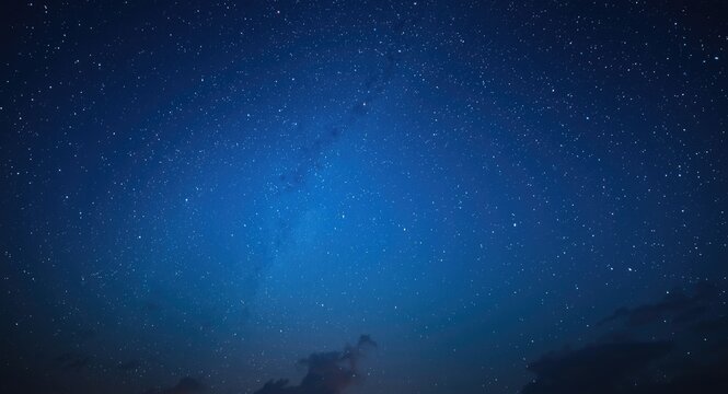 Blue themed Taurus horoscope set against celestial sky view