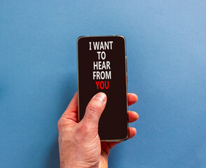 I want to hear from you symbol. Concept words I want to hear from you on beautiful phone screen. Beautiful blue background. Business support I want to hear from you concept. Copy space.