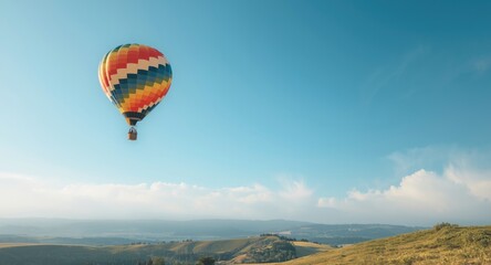 Aerostat transport with bright basket ascending in clear summer atmosphere