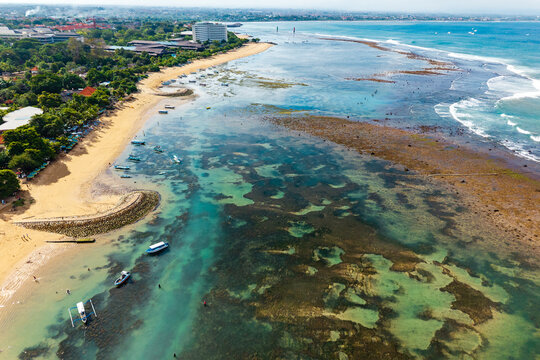 Beautiful tropical holiday destination with sandy beach, clear water and fringing reef