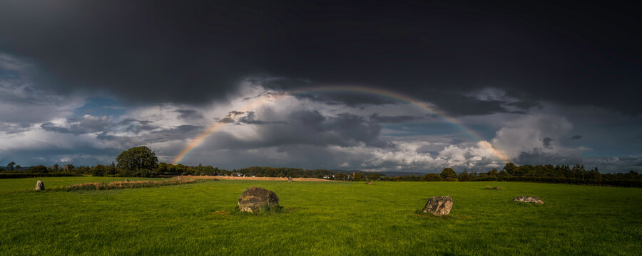 rainbow over stone circle in Scotland