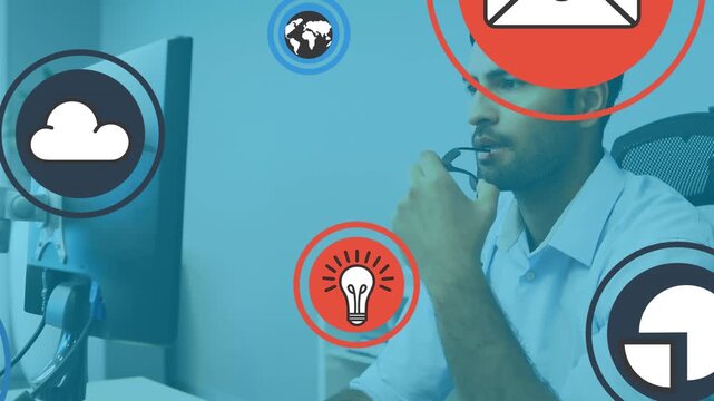 Animation of online icons over caucasian businessman