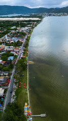 Fototapeta premium Aerial Waterfront Village Boats Restaurants Atlantic Forest Hills Lagoa Da Conceicao Florianopolis Brazil Island Coastal Scenery Santa Catarina South America Travel Destination