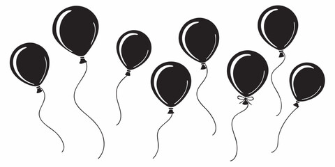 A group of black balloons with long strings floating in the air Vector © rabbi