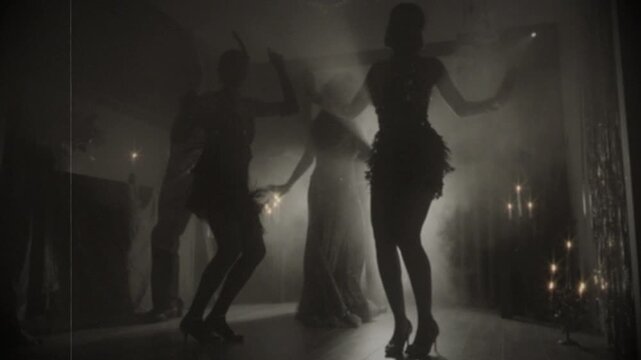 1920s old style black and white color group of people dancing crowd enjoying time in dark night club. girls flapper female male have fun at dance floor birthday party old retro, youth roaring twenties