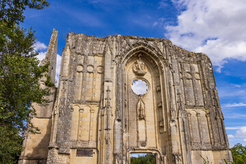Fototapeta premium Aulnay abbey ruins standing against blue sky in Centre Val de Loire, France