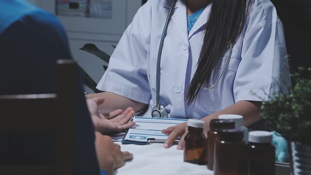 Doctor using stethoscope take a tap on the patient's arm and pressing pressure gauge button.