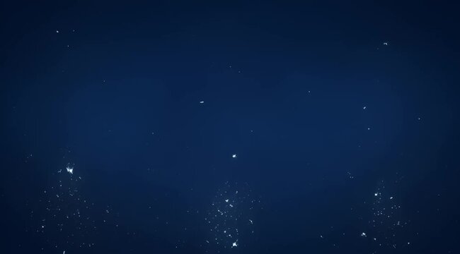 Abstract deep blue background with sparse specks of white light creating depth