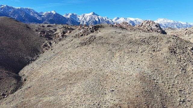 CALIFORNIA - 2.24.2026 - Excellent aerial footage moving towards snow-capped peaks of the Sierra Nevadas.