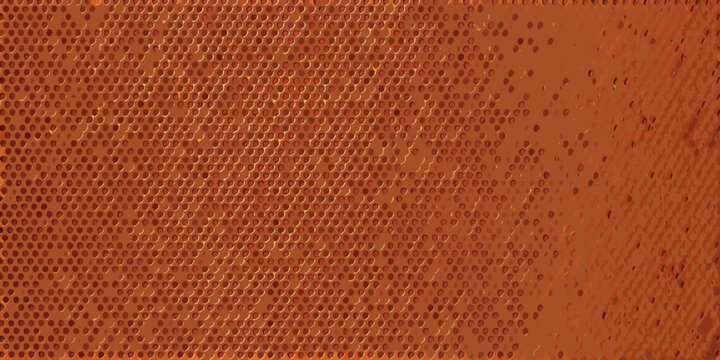 Close up of a textured orange surface with a perforated pattern