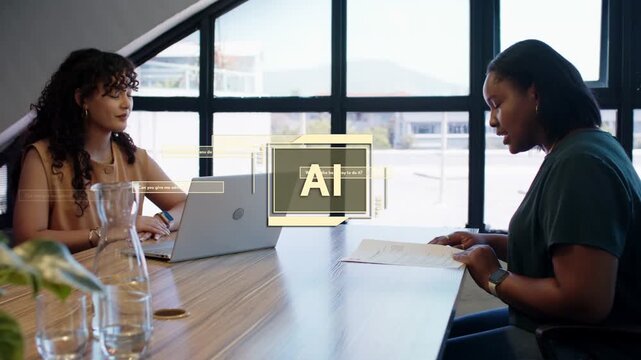 Two women reading document and typing laptop in biz meeting, AI appearing, flagging data for review