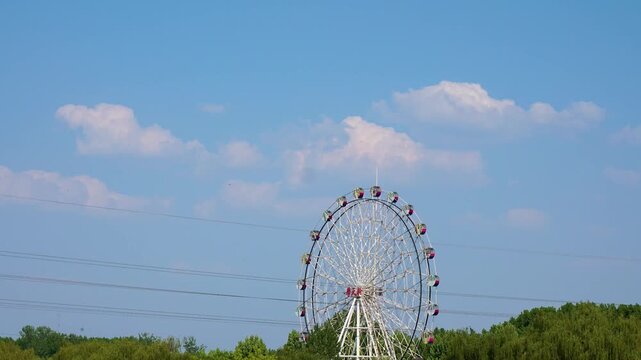London Eye Against Blue Sky with Puffy Clouds