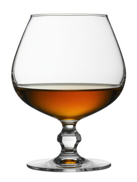 Empty glass snifter with amber liquid on white background